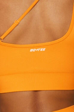Asymmetric Seamless Crop Top In Orange -Core Fit Shop BT0021 5 Evolve Orange Cross Over Sports Bra 2