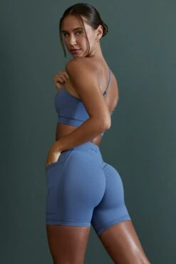 Asymmetric Neckline Sports Bra In Blue -Core Fit Shop BT0600 BT0607 10 Enhance Robust Blue Cross Over Sports Bra Cycling Shorts fb93f0b1 fbbb 4e6e a53e aac37ca0a480