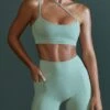 Asymmetric Neckline Sports Bra In Sage 1 Asymmetric Neckline Sports Bra In Sage -Core Fit Shop BT0600 BT0607 3 Enhance Robust Green Cross Over Sports Bra Cycling Shorts