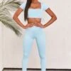 Slinky Crop Top In Ice Blue 2 Slinky Crop Top In Ice Blue -Core Fit Shop bt0008 bt0009 1 light blue short sleeved side tied bust flattering crop top high waisted leggings two piece workout sportswear e6e83762 0b11 4ef1 a958 caa20a259a0c