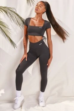 Slinky Crop Top In Black 10 Slinky Crop Top In Black -Core Fit Shop bt0008 bt0009 3 black short sleeved side tied bust flattering crop top high waisted leggings two piece workout sportswear 6c15e58f 084b 4d9b a4fc 89310a3ab848