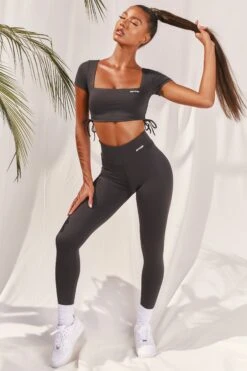 Slinky Crop Top In Black 11 Slinky Crop Top In Black -Core Fit Shop bt0008 bt0009 4 black short sleeved side tied bust flattering crop top high waisted leggings two piece workout sportswear 319bff0c 8393 42a2 8759 fd94a251f257