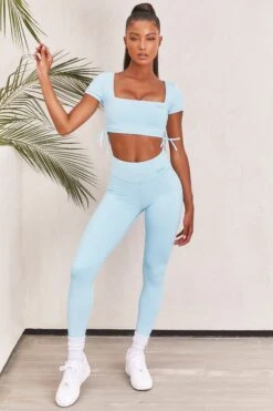 Slinky Crop Top In Ice Blue -Core Fit Shop bt0008 bt0009 4 light blue short sleeved side tied bust flattering crop top high waisted leggings two piece workout sportswear 742181fd 1680 4e56 bcbb f5208c9ff0be