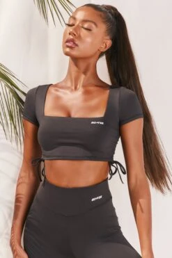 Slinky Crop Top In Black 12 Slinky Crop Top In Black -Core Fit Shop bt0008 bt0009 5 black short sleeved side tied bust flattering crop top high waisted leggings two piece workout sportswear