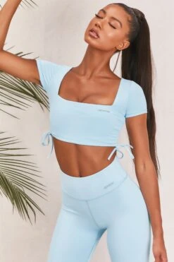 Slinky Crop Top In Ice Blue -Core Fit Shop bt0008 bt0009 6 light blue short sleeved side tied bust flattering crop top high waisted leggings two piece workout sportswear
