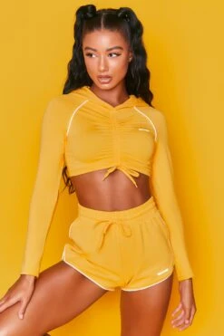 On Track Mini Runner Shorts In Orange