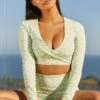Growth Slinky Long Sleeve Crop Top In Green -Core Fit Shop bt0061 1 growth green long sleeve cross over bust flattering floral crop top