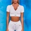 Perform Ribbed Short Sleeve Zip Front Crop Top In White -Core Fit Shop bt0102 bt0104 1 perform results white ribbed zip short sleeve crop tshirt crop top shorts drawstring two piece set