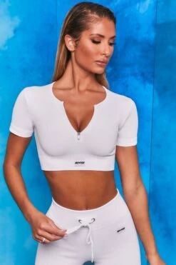 Perform Ribbed Short Sleeve Zip Front Crop Top In White 13 Perform Ribbed Short Sleeve Zip Front Crop Top In White -Core Fit Shop bt0102 bt0104 6 perform results white ribbed zip short sleeve crop tshirt crop top shorts drawstring two piece set