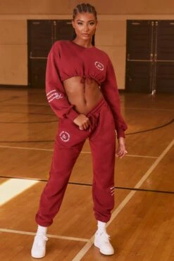Keep Moving Cropped Drawstring Sweatshirt In Burgundy -Core Fit Shop bt0201 bt0202 4 keep moving champion burgundy cropped drawstring sweatshirt joggers set