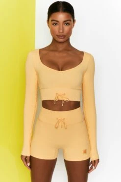 Time Check Ribbed Long Sleeve Crop Top In Yellow -Core Fit Shop bt0301 bt0306 1 move it time check yellow high waist draw string ribbed cycle shorts long sleeved strap crop top
