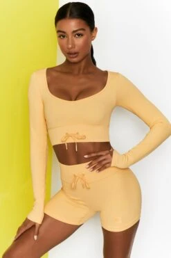 Time Check Ribbed Long Sleeve Crop Top In Yellow -Core Fit Shop bt0301 bt0306 3 move it time check yellow high waist draw string ribbed cycle shorts long sleeved strap crop top