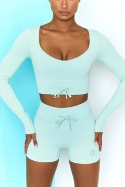 Time Check Ribbed Long Sleeve Crop Top In Light Blue -Core Fit Shop bt0301 bt0306 4 move it time check light blue long sleeved strap crop top tie front shorts ribbed pastel