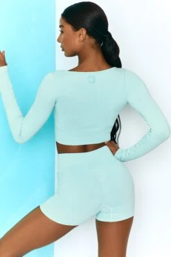 Time Check Ribbed Long Sleeve Crop Top In Light Blue -Core Fit Shop bt0301 bt0306 6 move it time check light blue long sleeved strap crop top tie front shorts ribbed pastel
