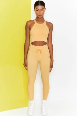 Energise Ribbed Tie Front Full Length Leggings In Yellow -Core Fit Shop bt0302 bt0304 1 energise yellow ribbed drawstring leggings feel your power ribbed cross strap crop top 3