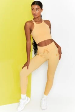 Energise Ribbed Tie Front Full Length Leggings In Yellow -Core Fit Shop bt0302 bt0304 2 energise yellow ribbed drawstring leggings feel your power ribbed cross strap crop top 1