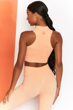 Miles Ahead Ribbed High Neck Crop Top In Peach -Core Fit Shop bt0305 bt0302 5 energise peach ribbed drawstring workout joggers mile ahead ribbed work out crop top 2