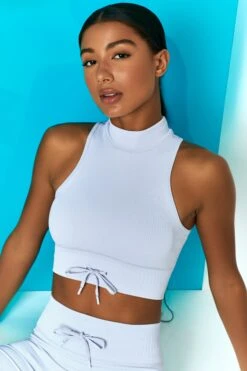 Miles Ahead Ribbed High Neck Crop Top In Cool Blue -Core Fit Shop bt0305 bt0318 10 miles ahead cool blue ribbed sleeveless turtle neck draw string crop top long distance ribbed draw string shorts