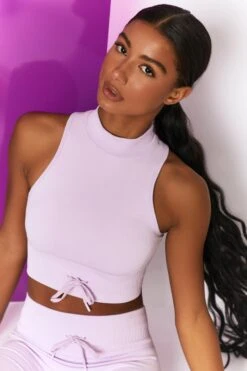Miles Ahead Ribbed High Neck Crop Top In Lilac -Core Fit Shop bt0305 bt0318 12 miles ahead lilac ribbed sleeveless turtle neck draw string crop top long distance ribbed draw string shorts