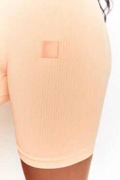 Ribbed Tie Front Cycling Shorts In Peach -Core Fit Shop bt0306 bt0318 9 time check long distance peach ribbed long sleeve cropped top ribbed draw string cycling shorts 1 1
