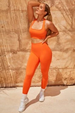 Cut Out Sports Bra In Deep Orange -Core Fit Shop bt0324 bt0342 3 intensity accelerate deep orange racer back sports bra contour leggings set 1 1