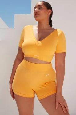 Curved Waist Seamless Mini Shorts In Light Orange -Core Fit Shop bt0361 bt0366 10 gradient flash light orange scrunched front short sleeve crop top high waist shorts sportswear set 5