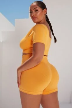 Curved Waist Seamless Mini Shorts In Light Orange -Core Fit Shop bt0361 bt0366 15 gradient flash light orange scrunched front short sleeve crop top high waist shorts sportswear set 5