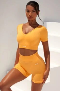 Curved Waist Seamless Mini Shorts In Light Orange -Core Fit Shop bt0361 bt0366 1 gradient flash light orange scrunched front short sleeve crop top high waist shorts sportswear set 3