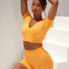 Curved Waist Seamless Mini Shorts In Light Orange -Core Fit Shop bt0361 bt0366 2 gradient flash light orange scrunched front short sleeve crop top high waist shorts sportswear set 3