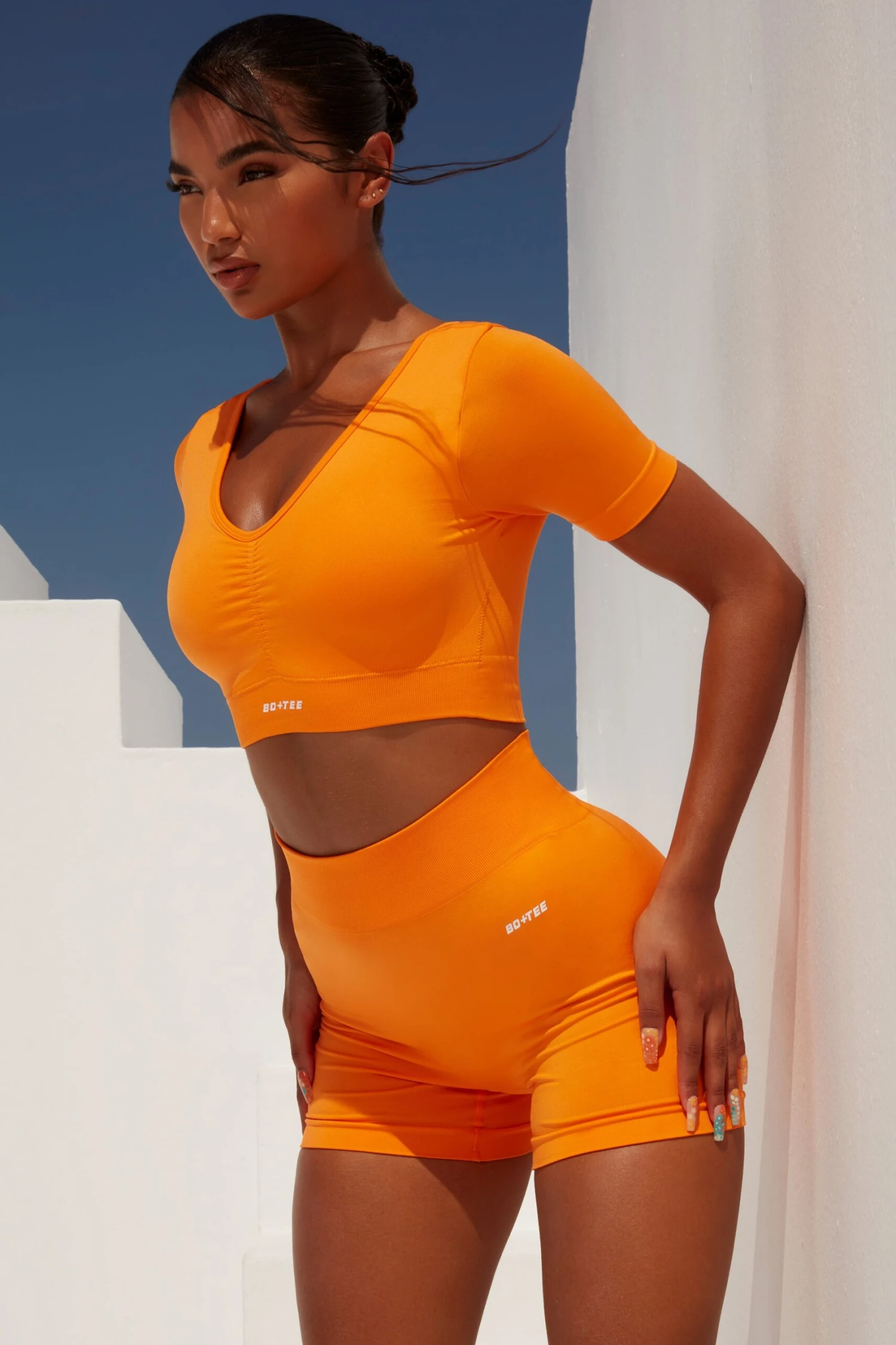 Curved Waist Seamless Mini Shorts In Orange 5 Curved Waist Seamless Mini Shorts In Orange - Image 3