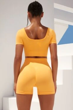 Gradient Scoop Neck Ruched Crop Top In Light Orange 10 Gradient Scoop Neck Ruched Crop Top In Light Orange -Core Fit Shop bt0361 bt0366 7 gradient flash light orange scrunched front short sleeve crop top high waist shorts sportswear set 1 1