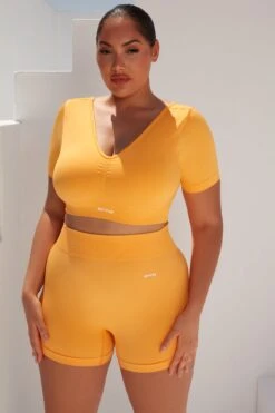 Curved Waist Seamless Mini Shorts In Light Orange -Core Fit Shop bt0361 bt0366 8 gradient flash light orange scrunched front short sleeve crop top high waist shorts sportswear set 3