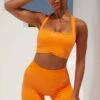 Radiate Ruched Sports Bra In Orange 1 Radiate Ruched Sports Bra In Orange -Core Fit Shop bt0363 bt0366 1 orange ribbed detail crop top high waisted shorts 1