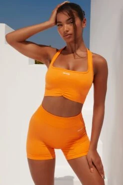 Radiate Ruched Sports Bra In Orange