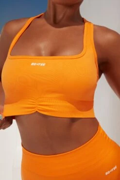 Radiate Ruched Sports Bra In Orange 21 Radiate Ruched Sports Bra In Orange -Core Fit Shop bt0363 bt0366 4 orange ribbed detail crop top high waisted shorts 1