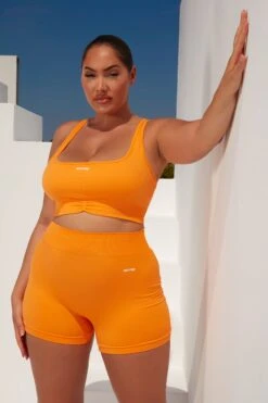 Radiate Ruched Sports Bra In Orange 23 Radiate Ruched Sports Bra In Orange -Core Fit Shop bt0363 bt0366 8 orange ribbed detail crop top high waisted shorts 1