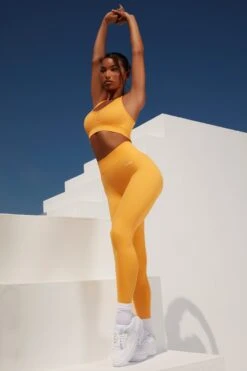 Surge Curved Waist Seamless Leggings In Light Orange 15 Surge Curved Waist Seamless Leggings In Light Orange -Core Fit Shop bt0364 bt0365 10 surge light orange leggings beam light crop top 2