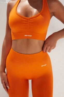 Surge Curved Waist Seamless Leggings In Deep Orange -Core Fit Shop bt0364 bt0365 1 surge deep orange leggings beam light crop top 2