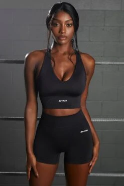 Racer Knot Back Seamless Crop Top In Black 12 Racer Knot Back Seamless Crop Top In Black -Core Fit Shop bt0366 bt0372 1 flash overhaul black scoop neck crop top shorts seamless sportswear 1