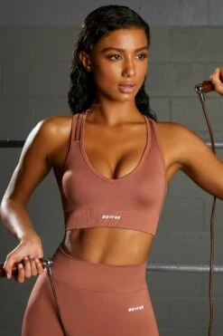 Emerge Cross Strap Seamless Plunge Sports Bra In Rust