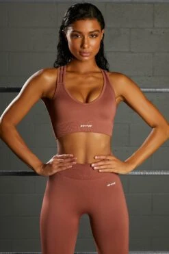 Emerge Cross Strap Seamless Plunge Sports Bra In Rust -Core Fit Shop bt0371 3 emerge rust strap detail plunge sports bra